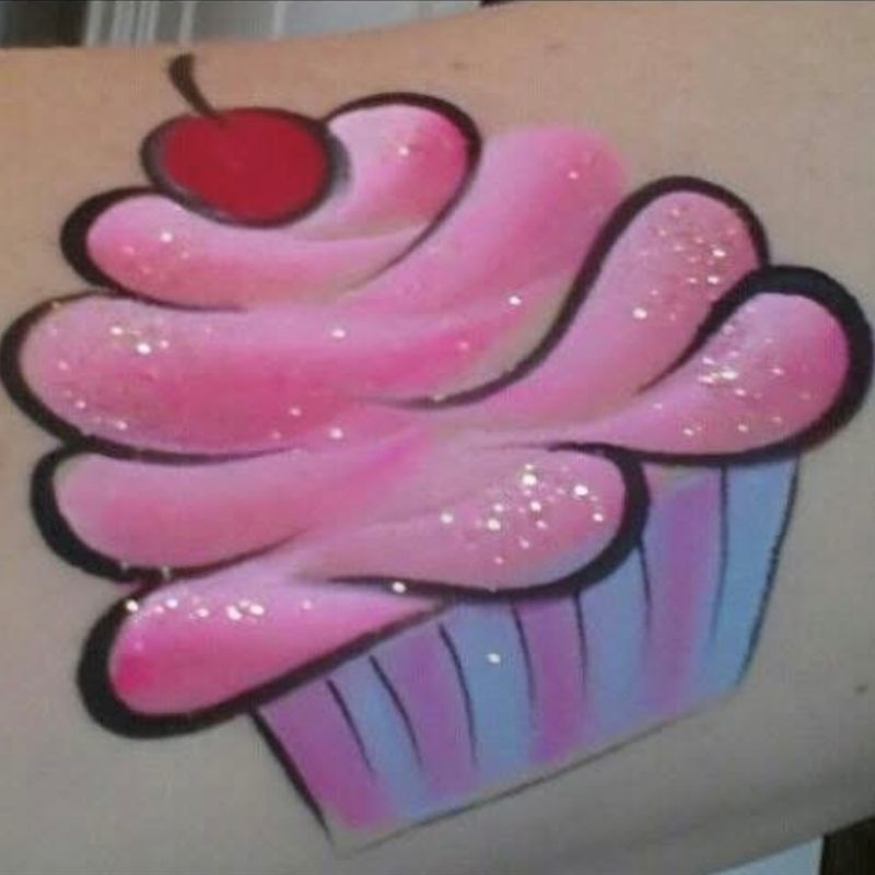 Pink cupcake painted on an arm